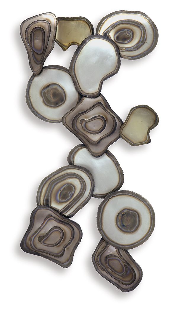 Multi-piece wall decor with heart, oval, and square resin discs in cream and dark brown
