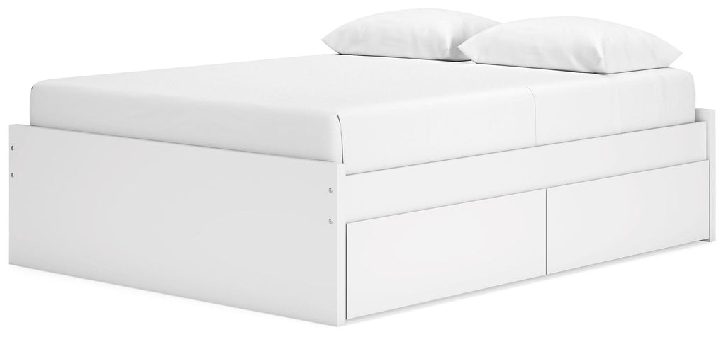 White platform bed with upholstered headboard and front storage drawers