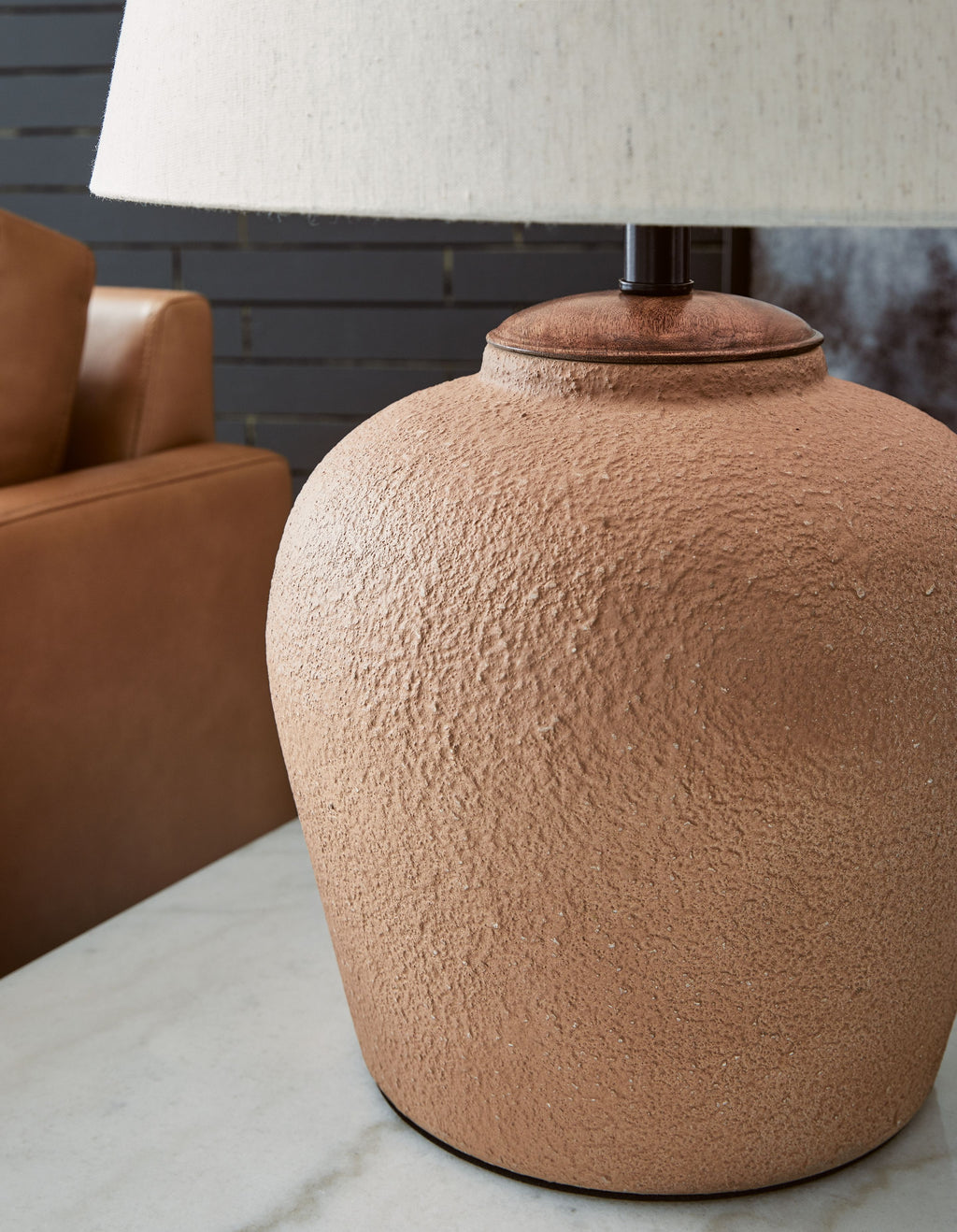 Metal table lamp, rust textured ceramic body and cream fabric drum shade