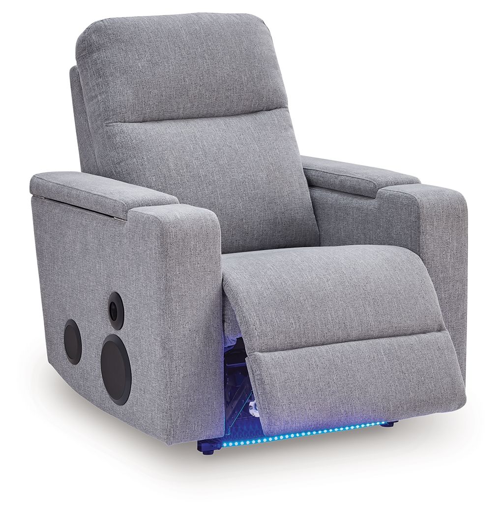 Pewter gray power recliner with side speakers, reclined seat and footrest support