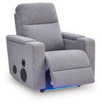 Pewter gray power recliner with side speakers, reclined seat and footrest support