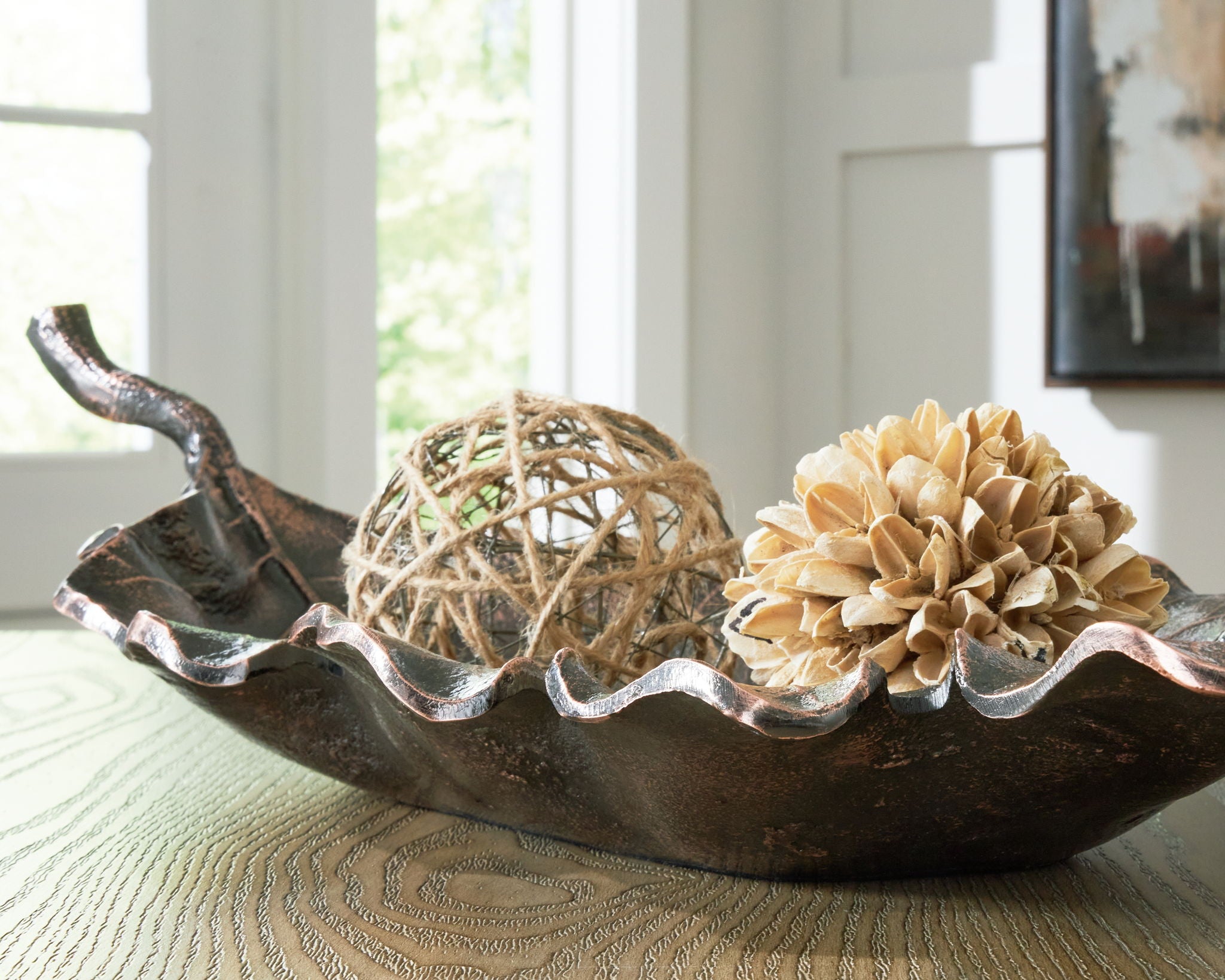 Antique copper leaf-shaped sculpture bowl with twine ball and beige flower