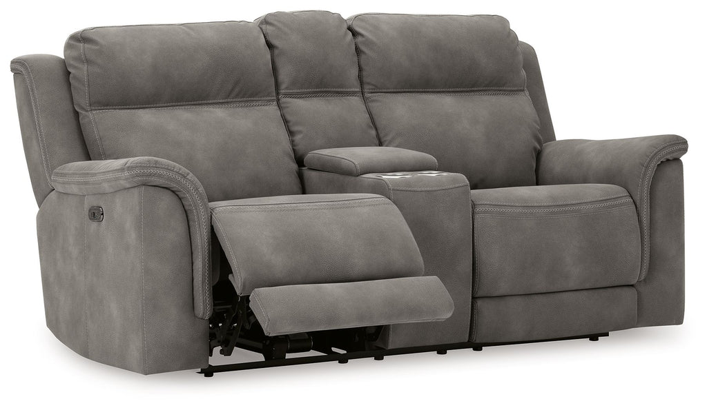 Dark gray reclining power loveseat with extended footrest and padded armrests