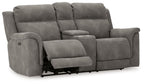 Dark gray reclining power loveseat with extended footrest and padded armrests