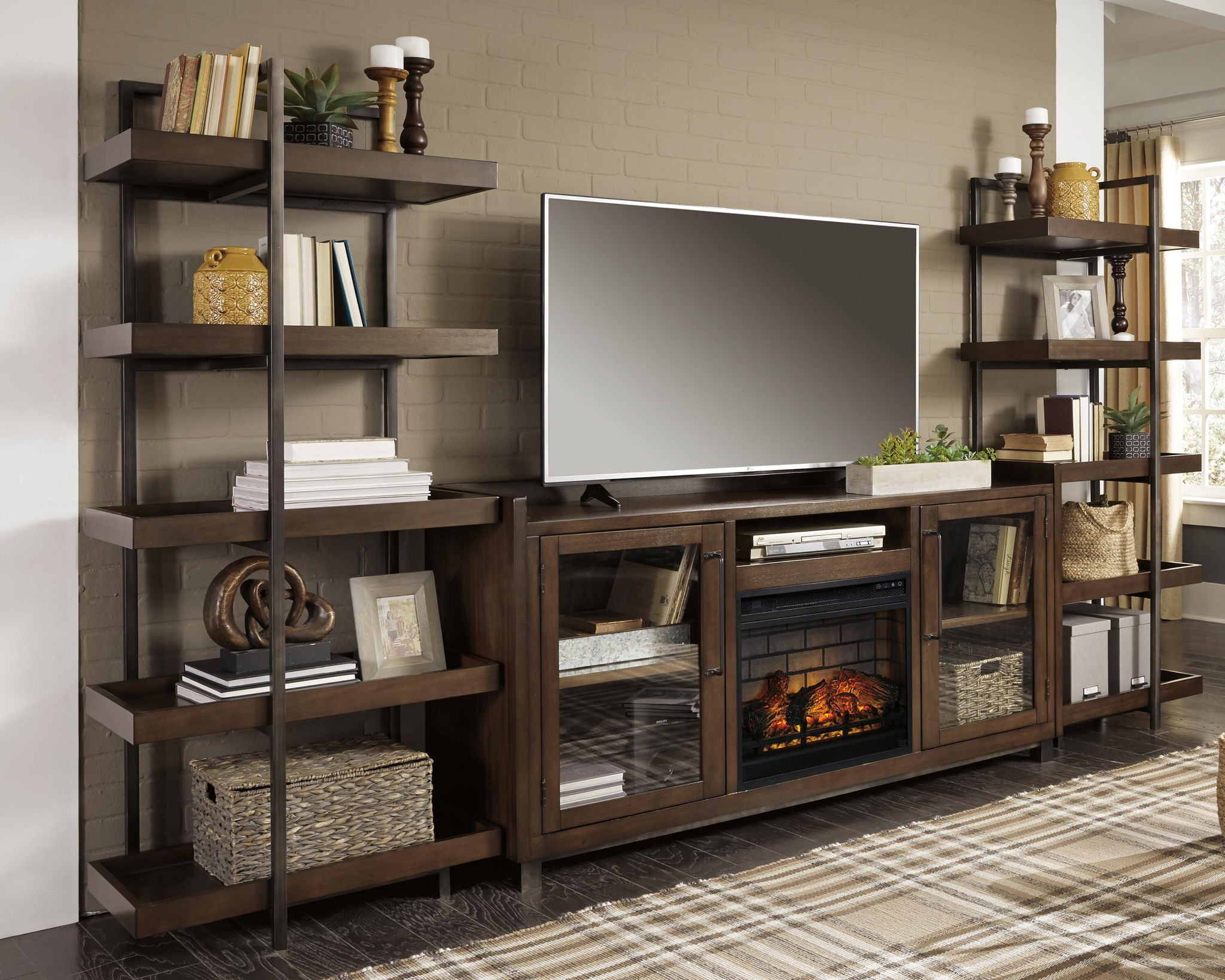 Dark brown entertainment center TV stand with faux fireplace insert and tiered side shelves