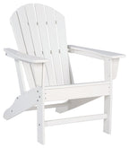 Outdoor Adirondack chair in white wood slats with wide arms and curved back.