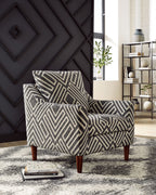 Accent chair in chevron geometric upholstery, dark charcoal and light natural, rolled cushion arms