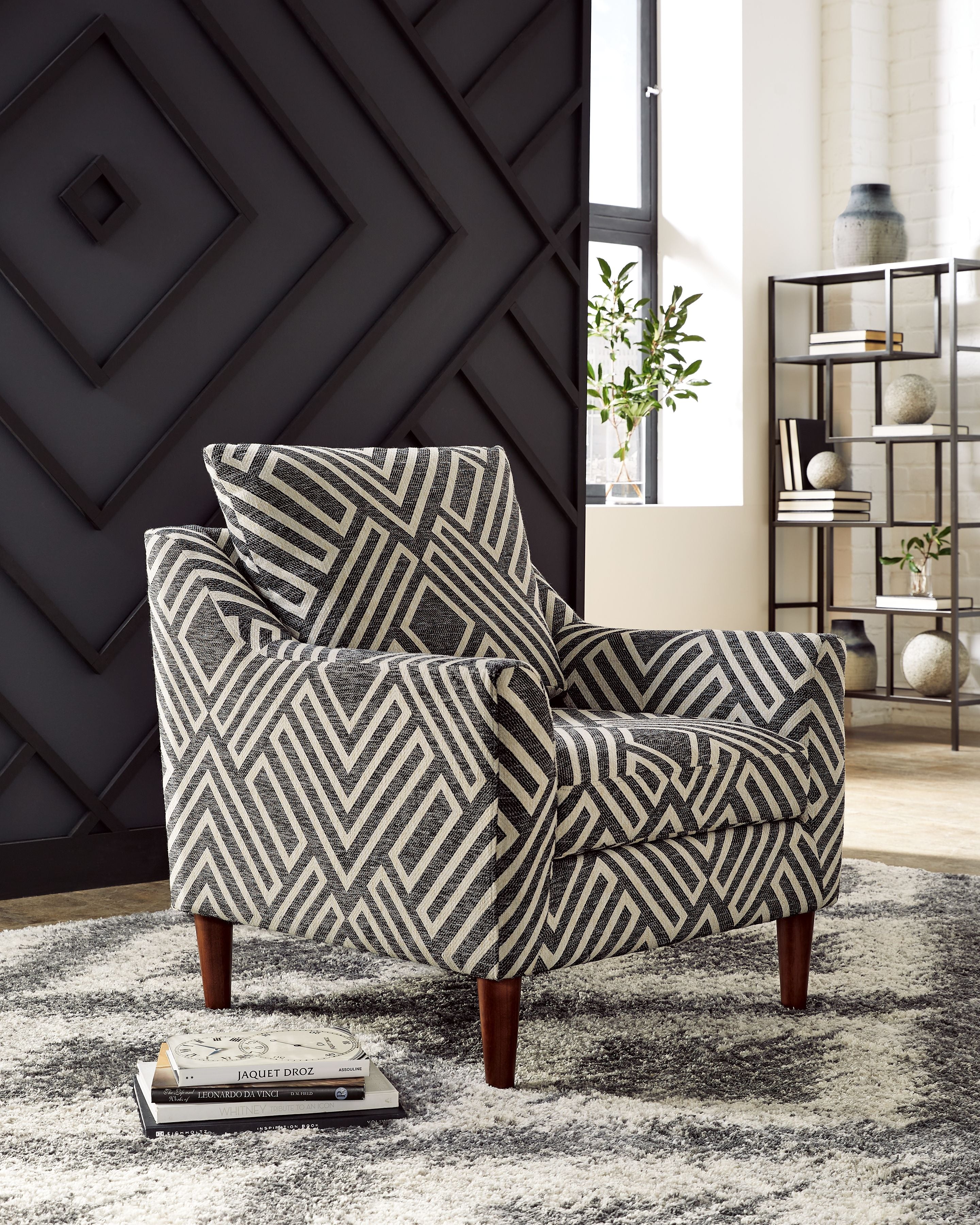Accent chair in chevron geometric upholstery, dark charcoal and light natural, rolled cushion arms