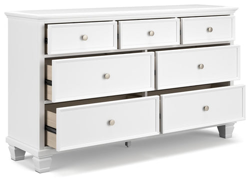 Fortman white dresser with partially open drawers, showing interiors and round knobs