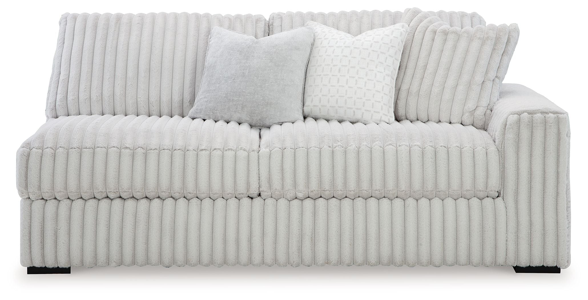 Light gray upholstered sofa with ribbed upholstery and two lumbar pillows