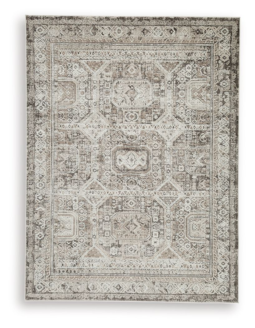 Vintage-style area rug with ornate geometric medallion in light gray and off-white