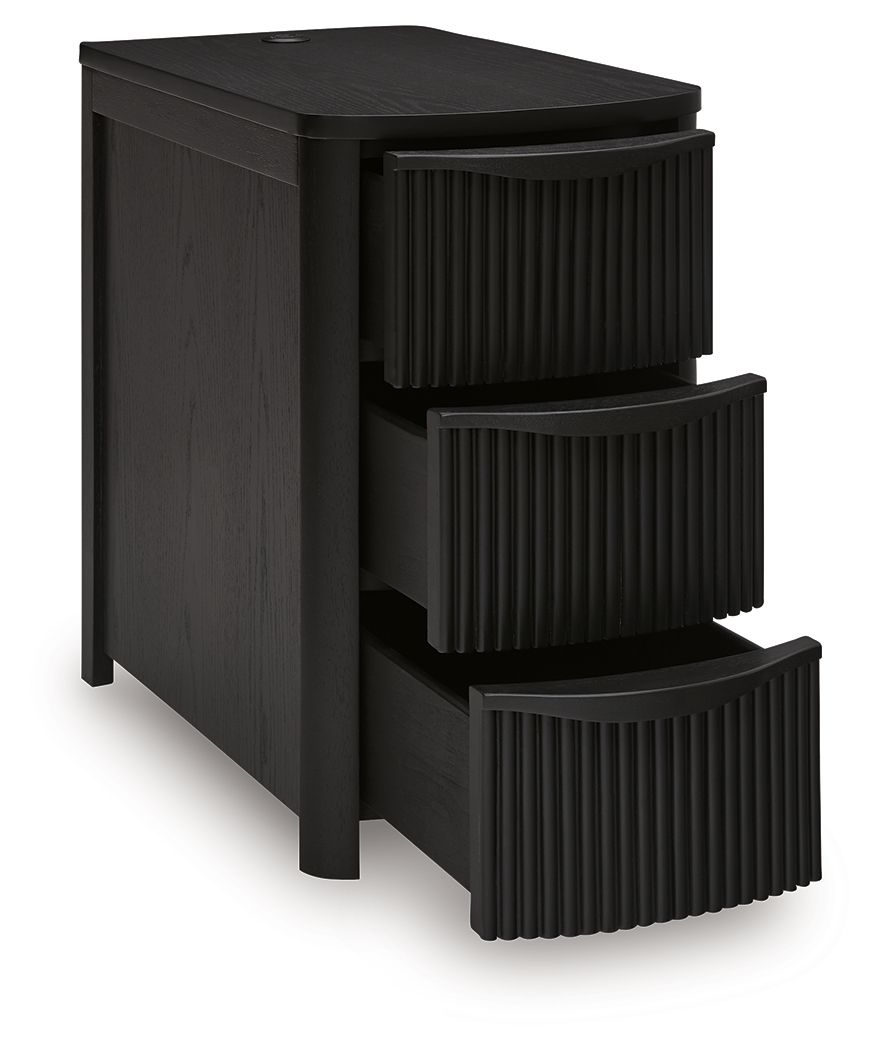 Black chair side end table with three stacked open drawers and vertical slat panels