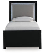 Upholstered panel bed with black frame, gray headboard panel, neatly set light bedding