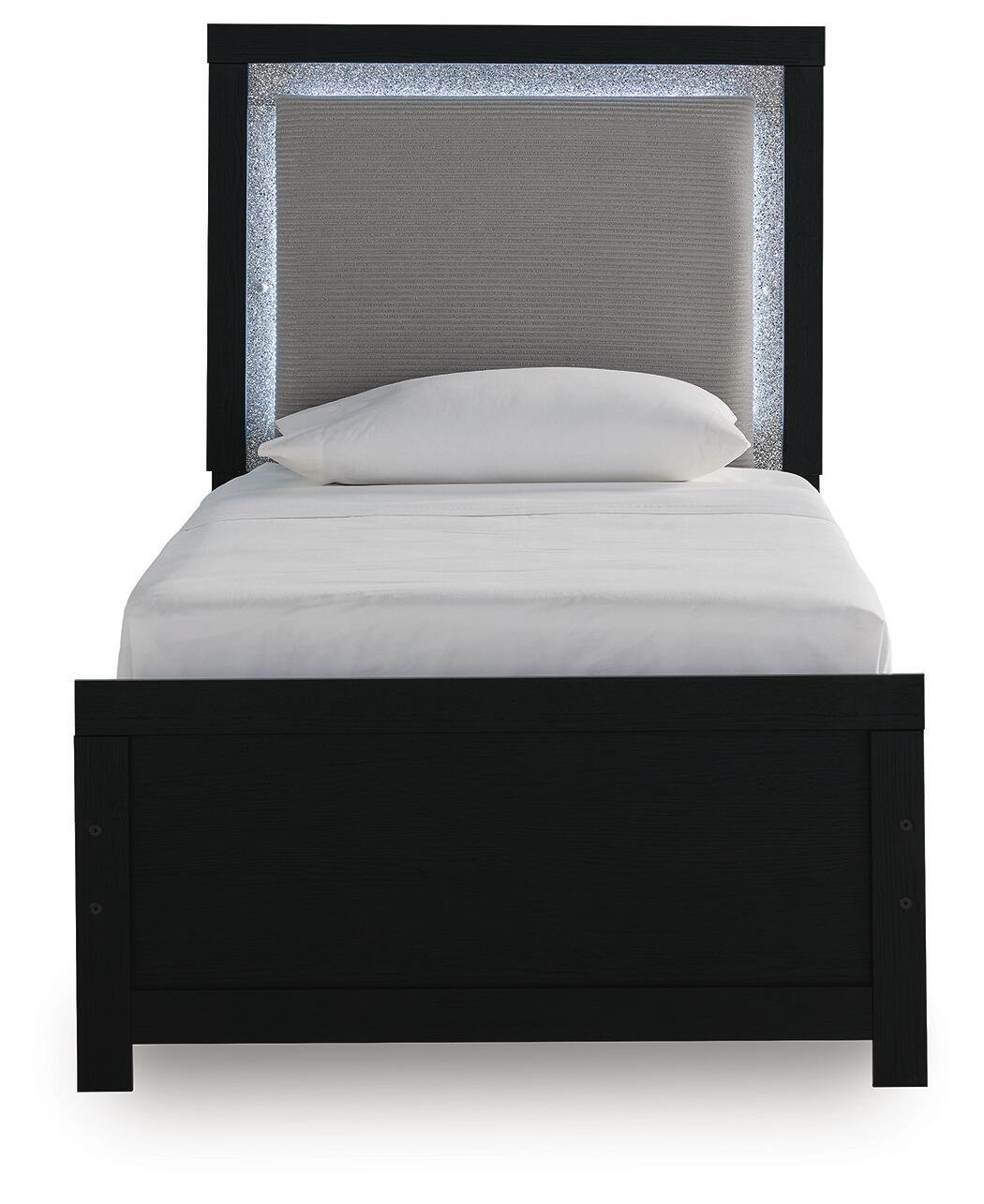 Upholstered panel bed with black frame, gray headboard panel, neatly set light bedding