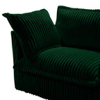 Green sectional armchair detail with ribbed upholstery and thick seat cushion