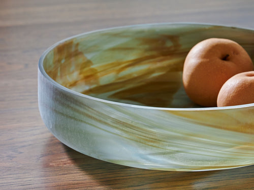 Sage green marbled glass bowl with round fruit inside