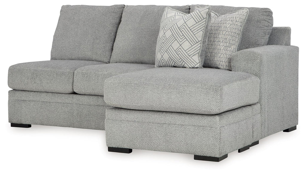 Upholstered grey sofa chaise with wide arm and back cushions