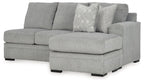 Upholstered grey sofa chaise with wide arm and back cushions