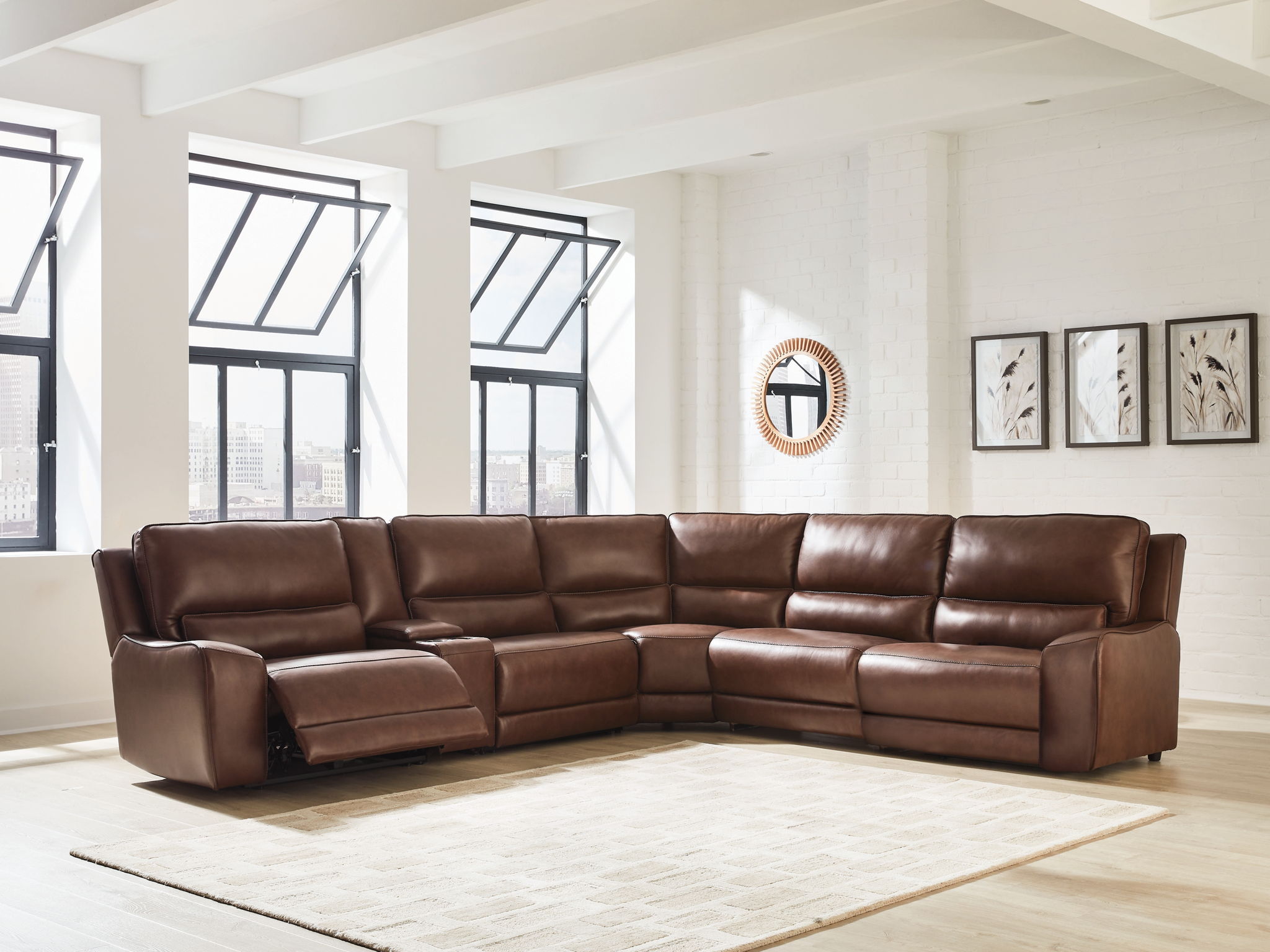 Power reclining sectional in dark brown faux leather with a chaise section