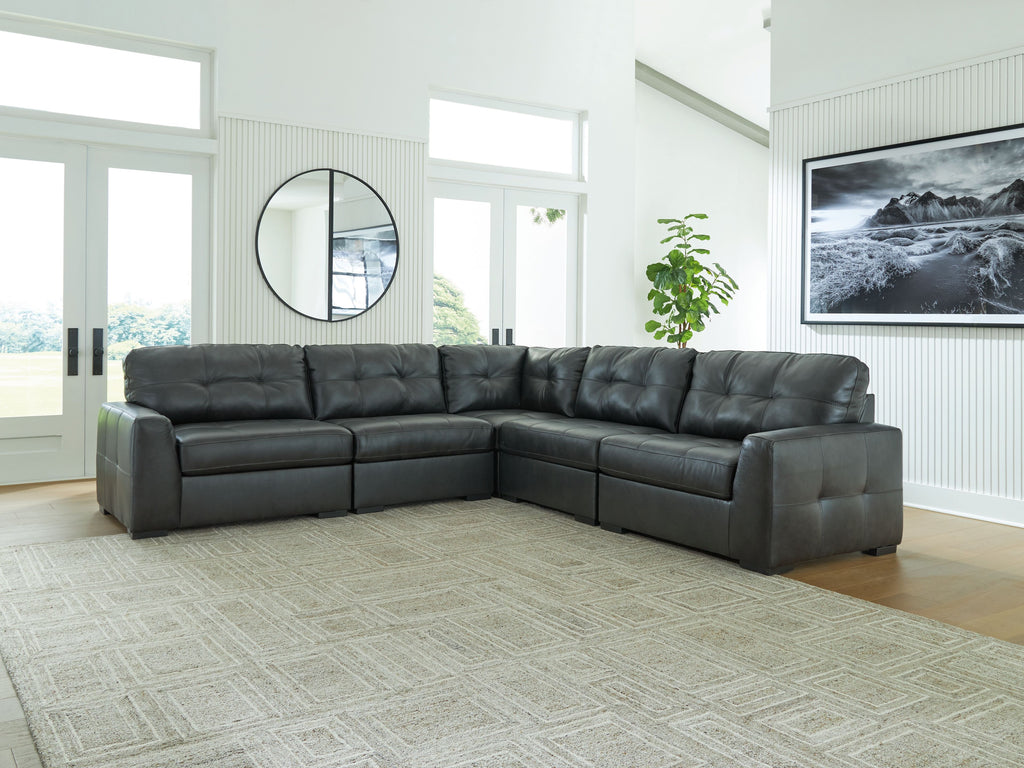 Sectional sofa with corner layout, tufted seat and back cushions in dark upholstery