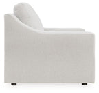 Light gray upholstered accent chair with padded armrests and low black feet