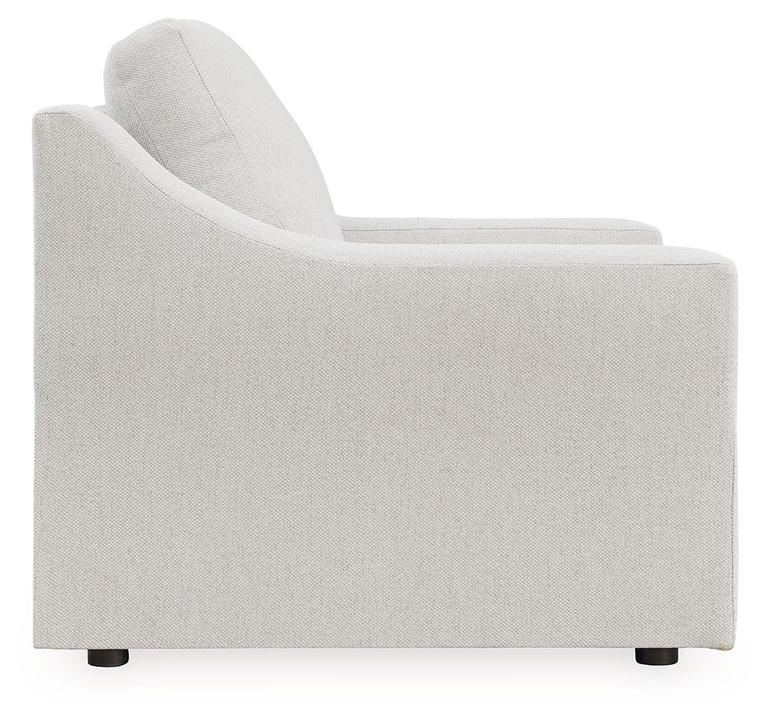Light gray upholstered accent chair with padded armrests and low black feet