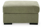 Green upholstered ottoman with rounded square top and black legs