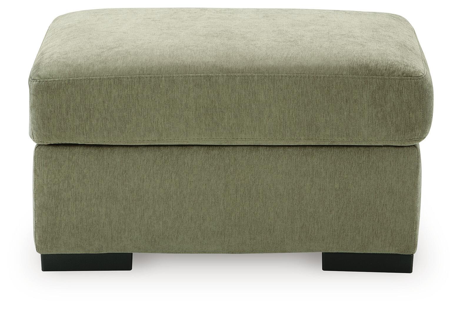 Green upholstered ottoman with rounded square top and black legs