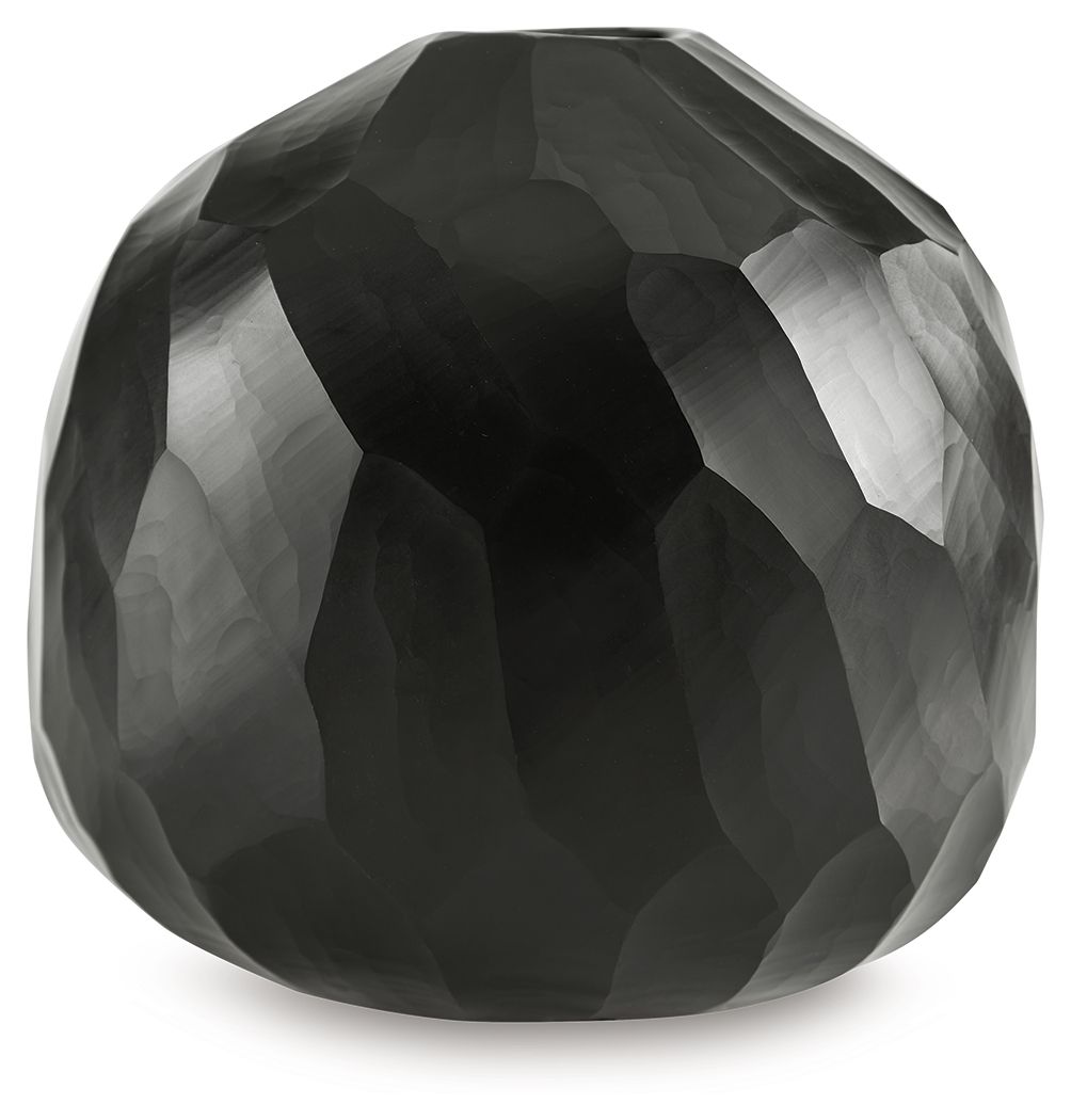 Black faceted vase with rounded shape and geometric surface pattern