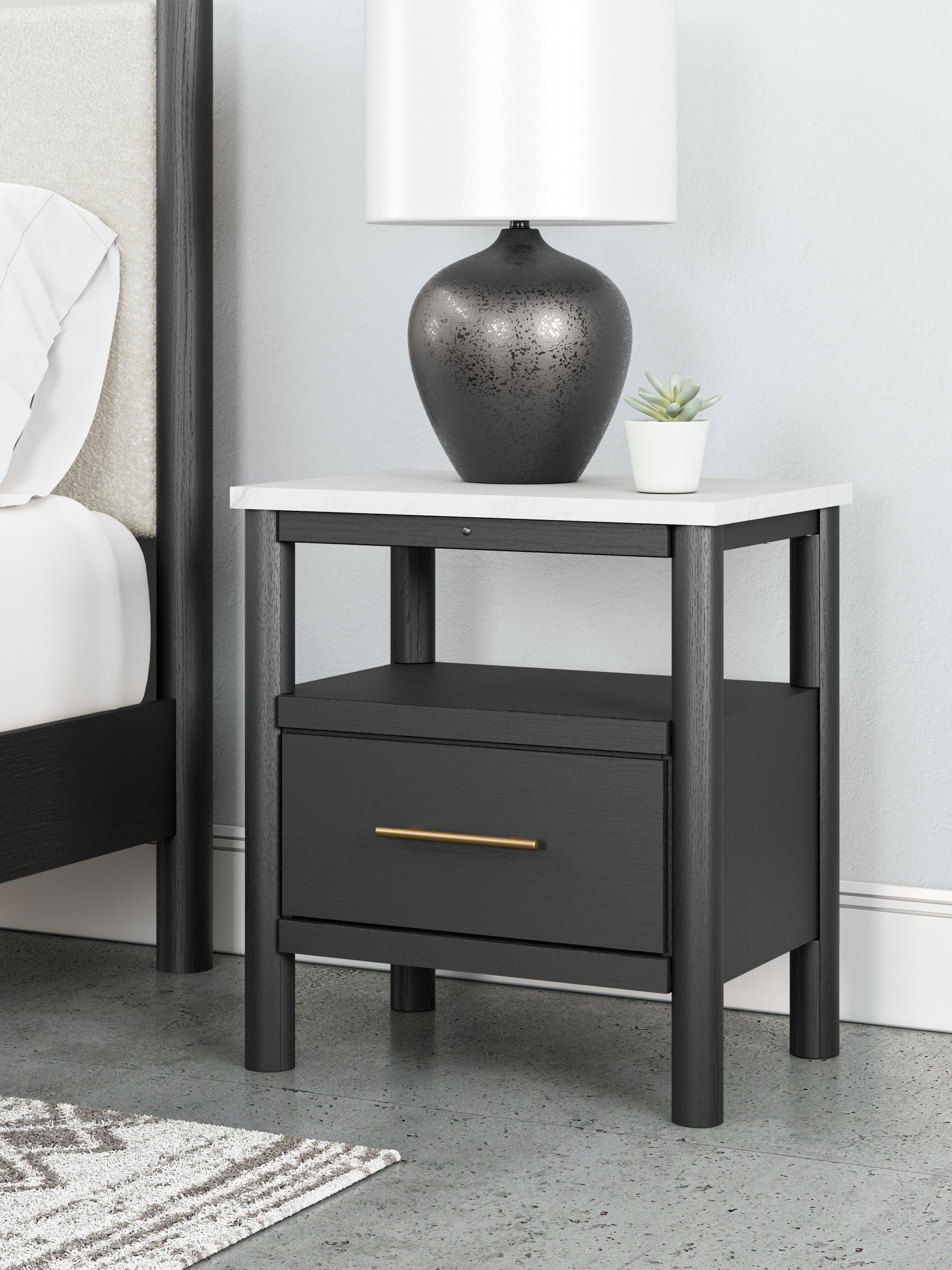 Black one-drawer night stand with open shelf, brass-toned bar handle