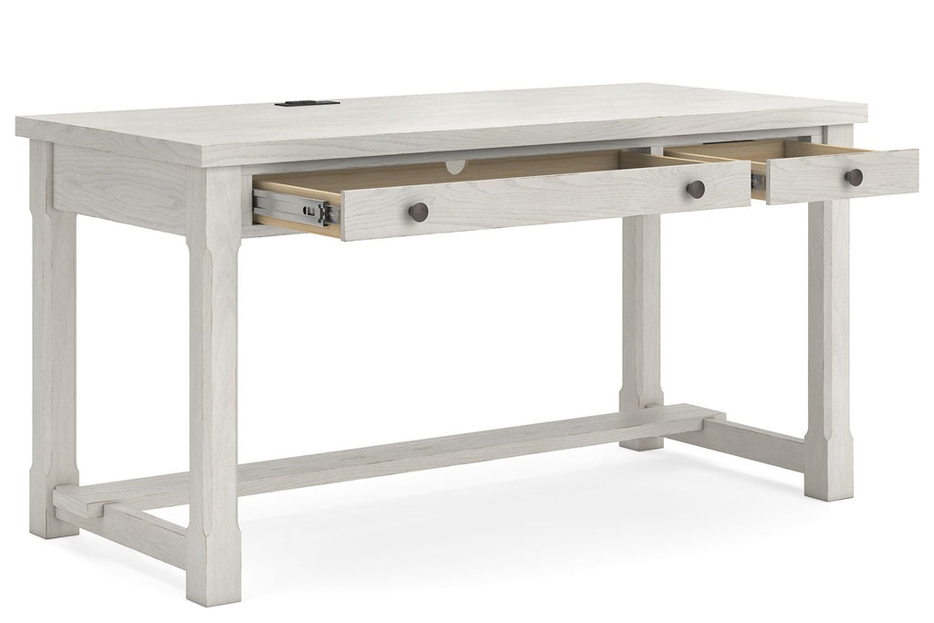 White desk with sliding drawer front and open lower shelf under the tabletop