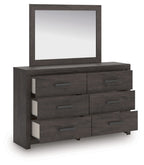 Charcoal dresser with six drawers and rectangular mirror, dark wood finish with metal pulls.