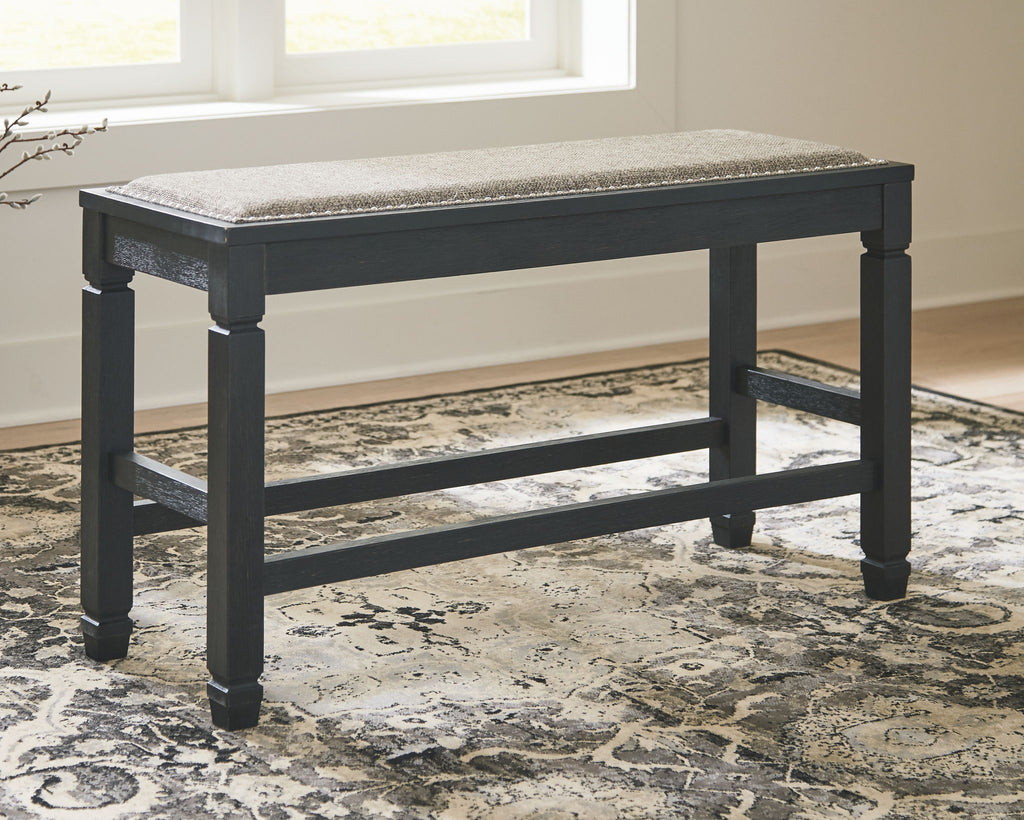 Antique black upholstered bench with cushioned top and lower support shelf, full view