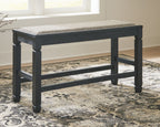 Antique black upholstered bench with cushioned top and lower support shelf, full view
