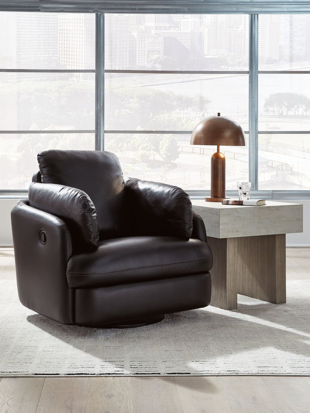 Black swivel glider recliner with wide seat, cushioned back, and side arms