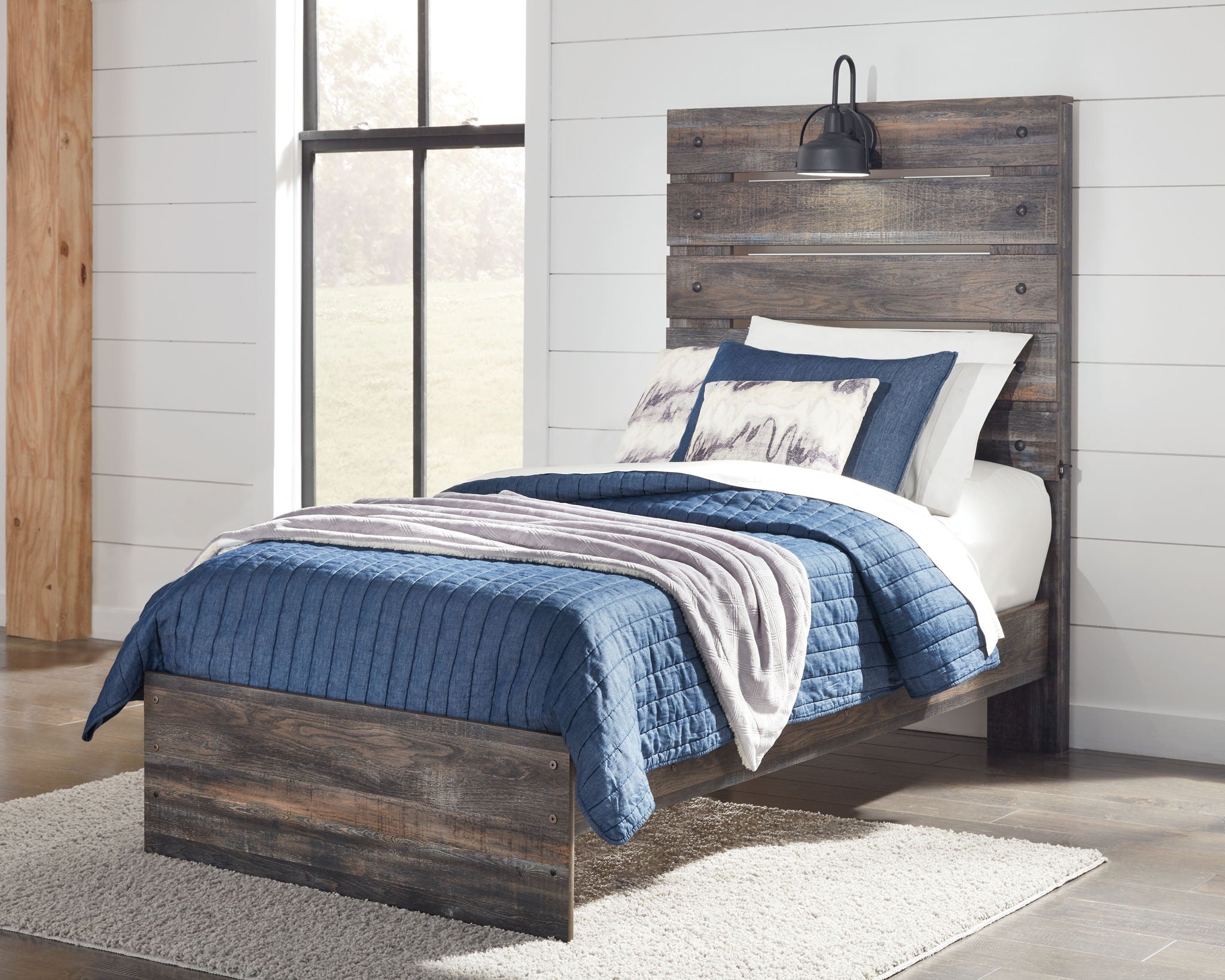 Panel bed with slatted headboard and dark wood frame, blue and white bedding