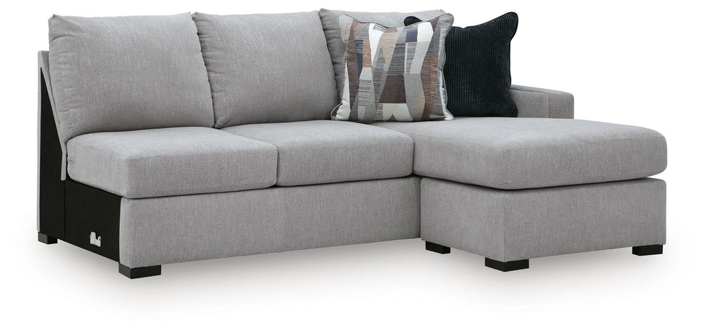 Gray upholstered RAF sofa chaise with right-facing ottoman section and dark throw pillows