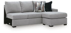 Gray upholstered RAF sofa chaise with right-facing ottoman section and dark throw pillows