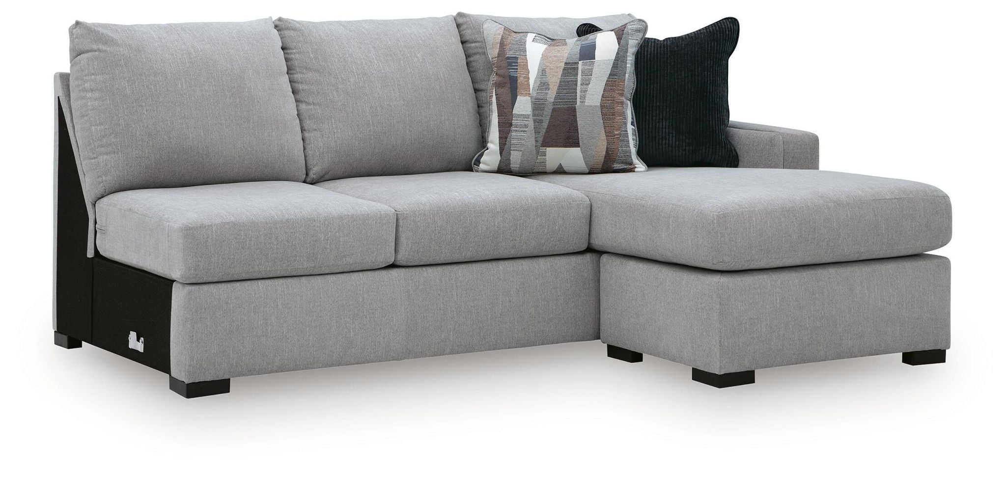 Gray upholstered RAF sofa chaise with right-facing ottoman section and dark throw pillows