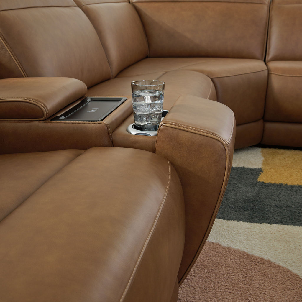 Caramel reclining sectional sofa with console and cupholders between seats
