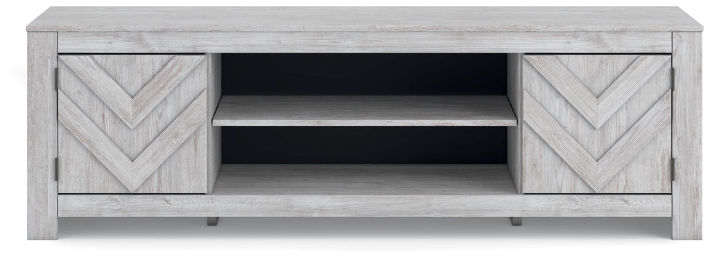 Light gray TV stand with chevron cabinet doors and open center compartment