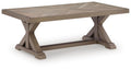 Beige rectangular cocktail table with beveled top and X-style support legs