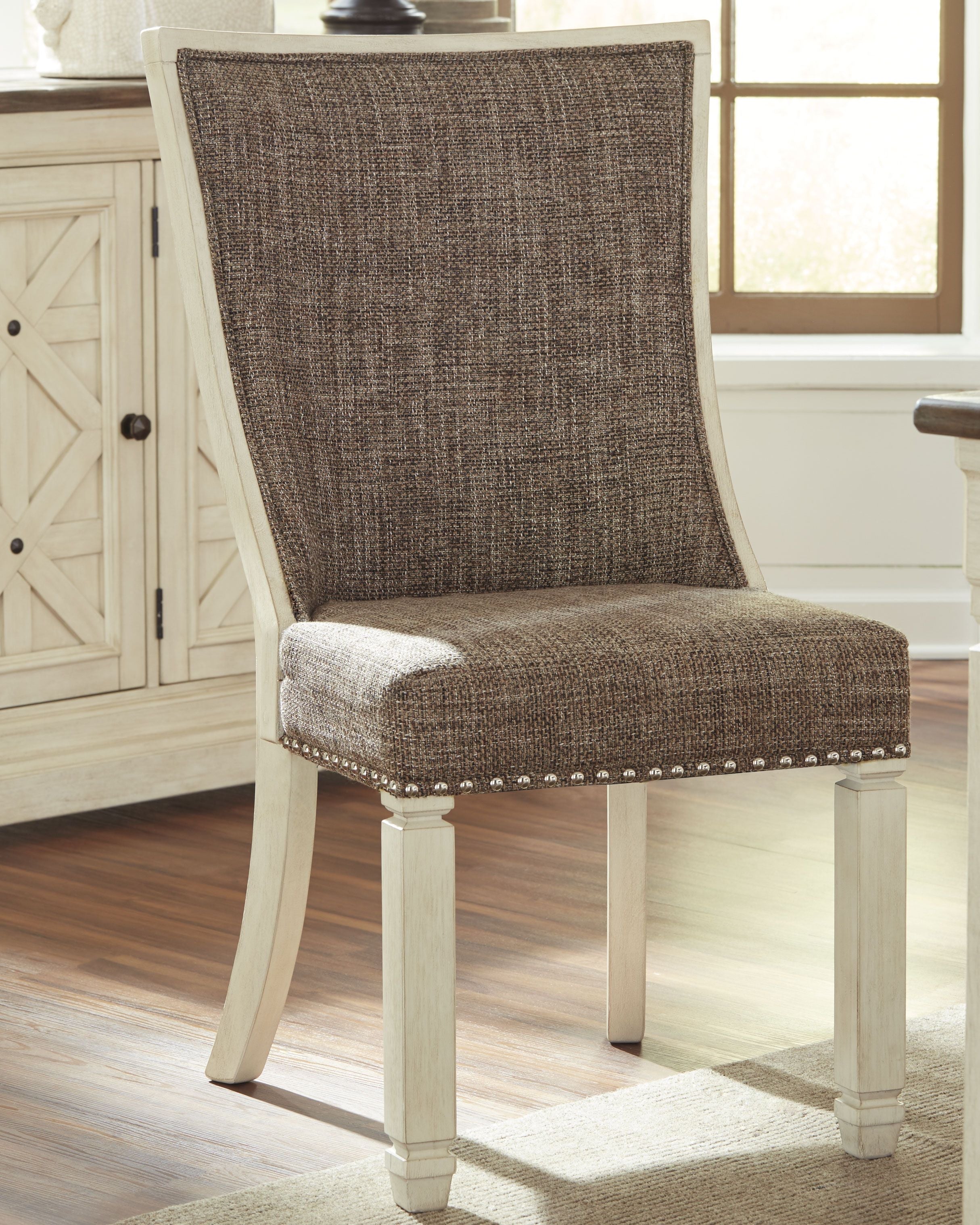 Upholstered dining side chair with lattice back, brown fabric, turned legs, nailhead trim