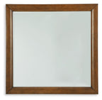 Square bedroom mirror with brown wooden frame and reflective glass surface