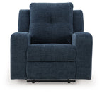 Ink blue upholstered wall recliner with tall headrest, padded armrests, and thick seat