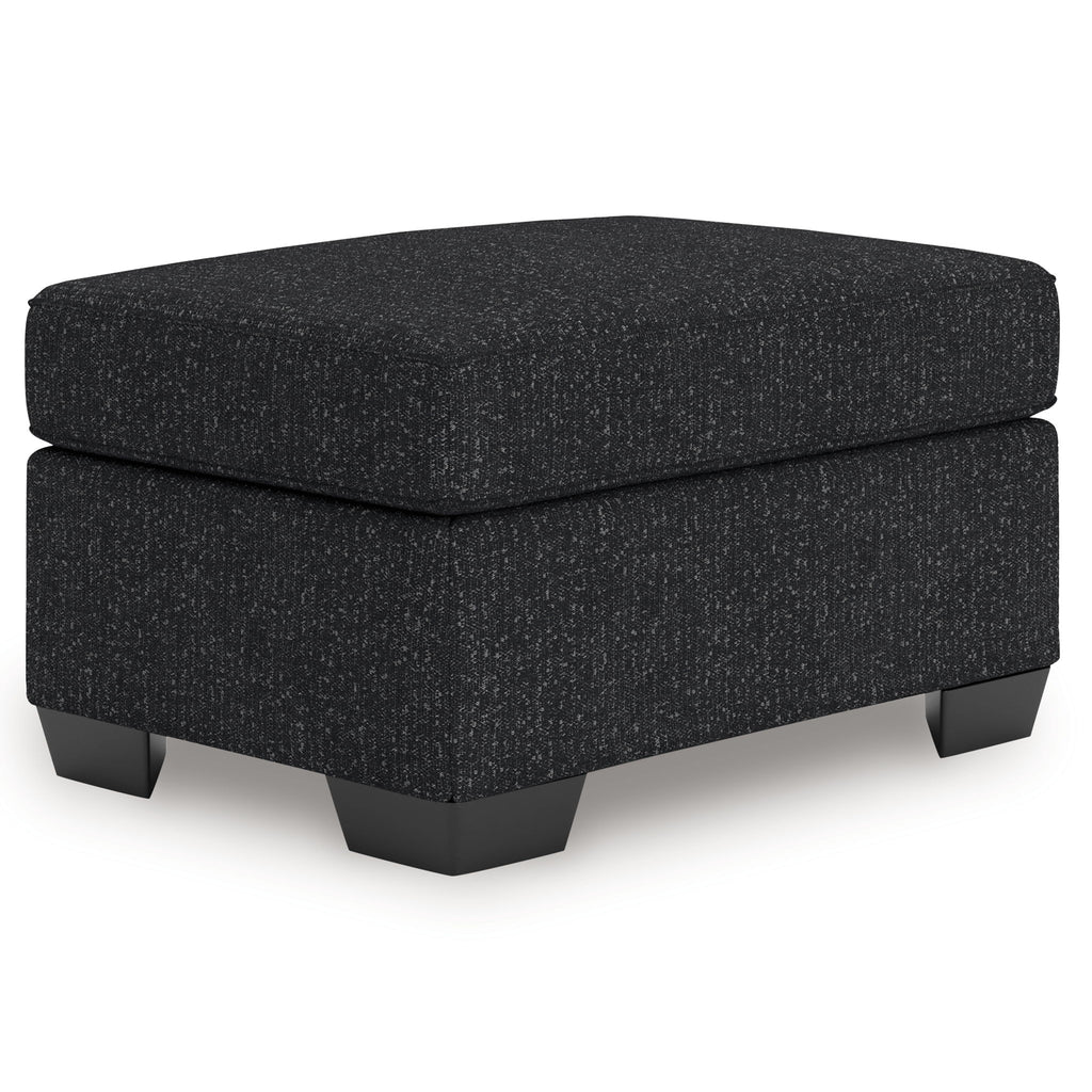 Coal gray upholstered ottoman with cushioned top and short block legs