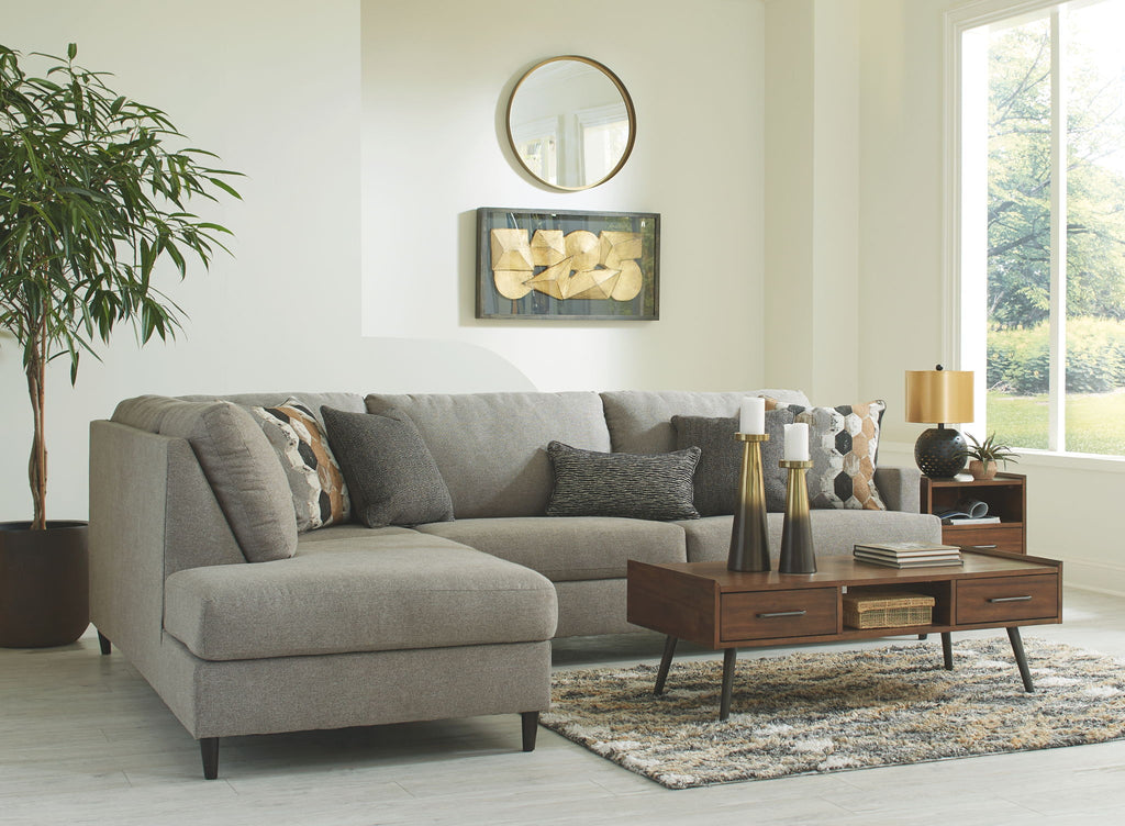 Granite gray fabric sectional sofa with chaise, rounded arms, and patterned accent pillows