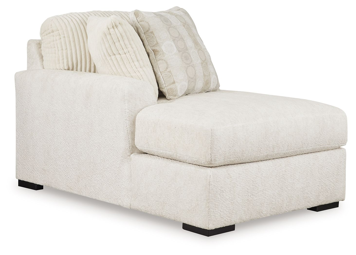 Ivory corner chaise with textured cushions and patterned throw pillows