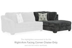 Dark gray right-arm facing corner chaise, with patterned throw pillow and tufted backrest.