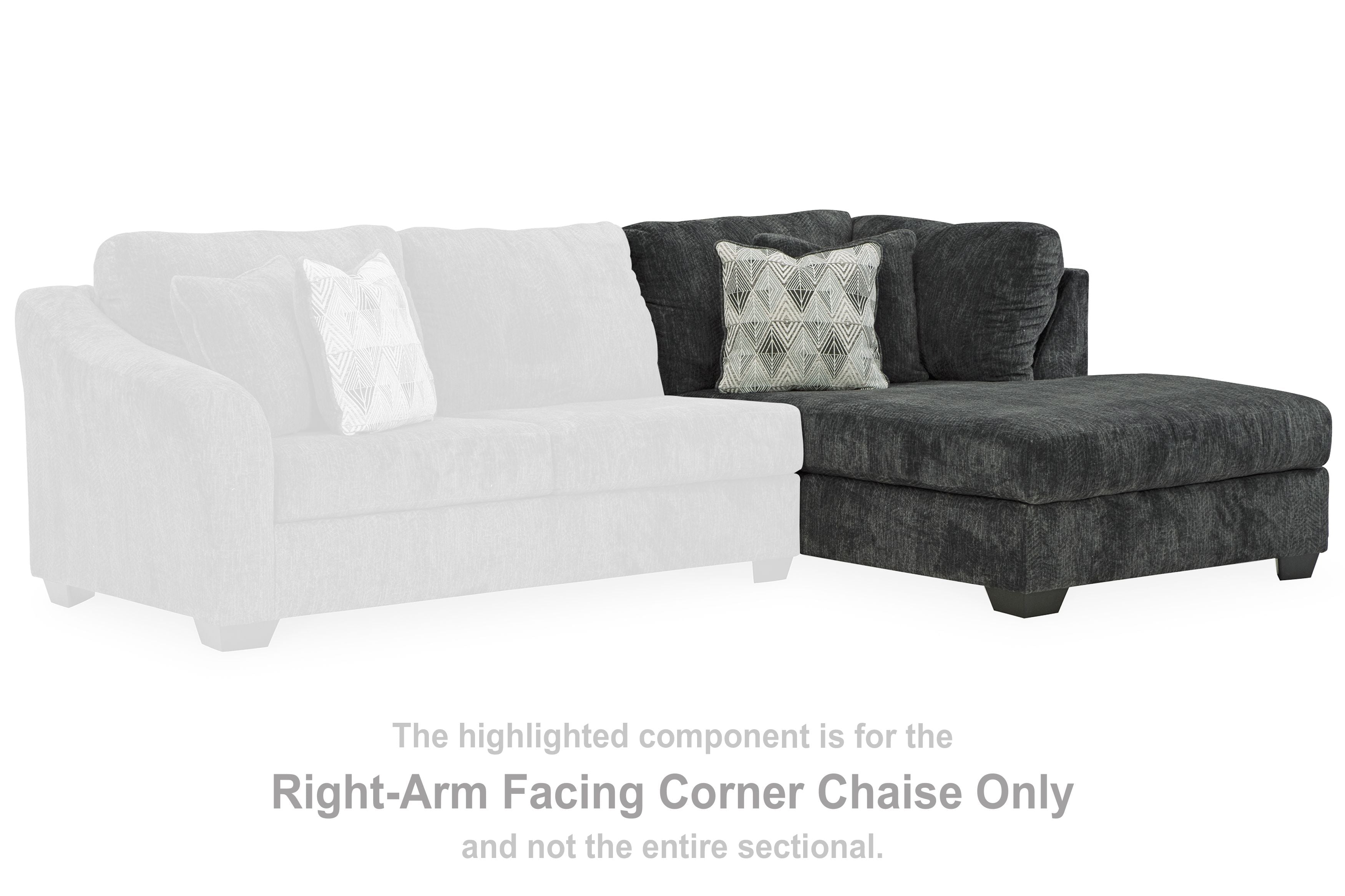 Dark gray right-arm facing corner chaise, with patterned throw pillow and tufted backrest.